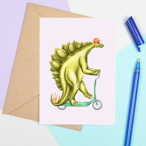 Stegosaurus on a scooter greeting card by Amélie Legault